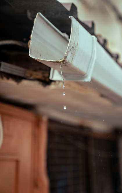 iowa gutter installation and iowa gutter cleaning photo with white gutter dripping water